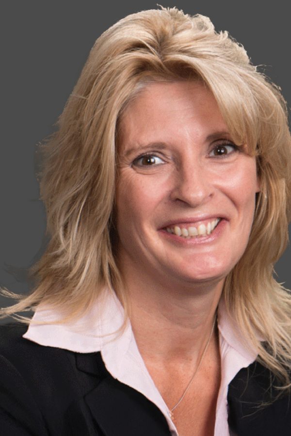 Adult female professional headshot on a blue background